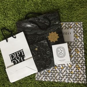 Diptyque box, bags, memento and artwork